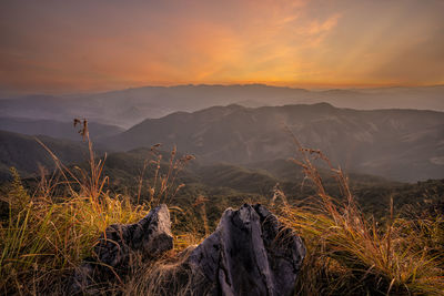 Scenic view of mountains against sky during sunset