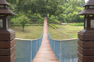 Footpath amidst trees and building