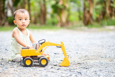 Portrait of cute boy with toy car