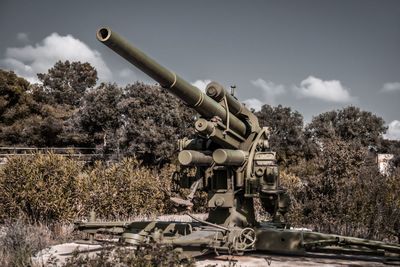 Built structure on field against sky