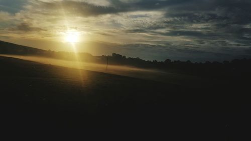 Scenic view of silhouette landscape against sky during sunset