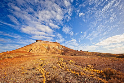 Scenic view of a desert formation against blue sky