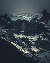 Aerial view of snowcapped mountains against sky