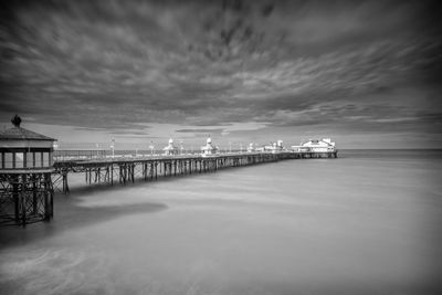 Pier over sea against sky