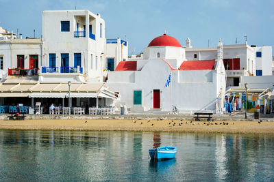 Blue fishing boat in port harbor on mykonos island, greece