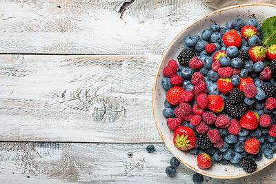 High angle view of strawberries in bowl on table