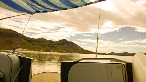 Close-up of nautical vessel on mountain against sky