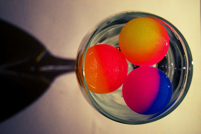 High angle view of eggs in glass on table