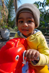 Portrait of smiling boy standing outdoors