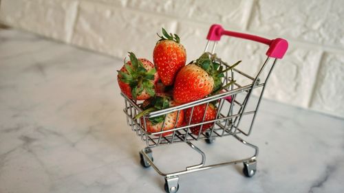 High angle view of strawberries in mini cart