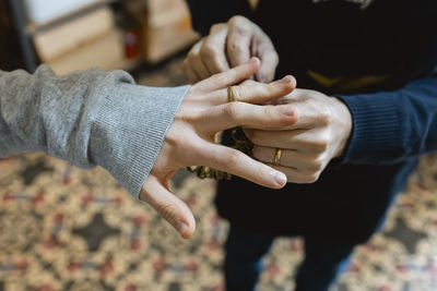 Midsection of man holding hands