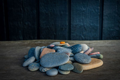 Pile of sea rocks on wooden bench