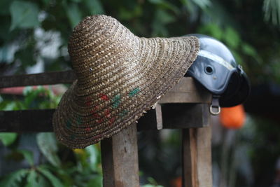 Close-up of gold tied up on wood