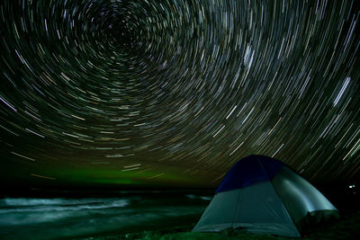 Low angle view of tent against sky at night