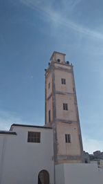 Low angle view of building against blue sky