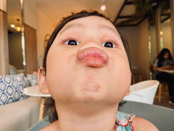 Close-up portrait of boy at home