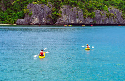 People on canoeing in sea