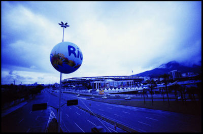 Road in town against sky at dusk