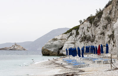 Padulella beach, a burgundy umbrella and lots of blue. elba island, italy.