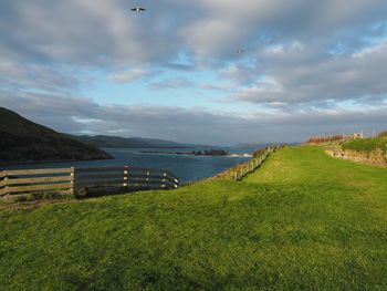 Scenic view of sea against cloudy sky