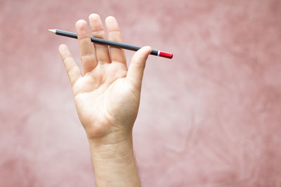 Close-up of hand holding finger