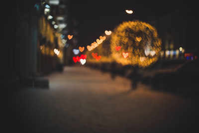 Defocused image of illuminated christmas lights at night