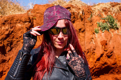 Portrait of young woman wearing hat