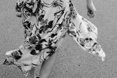 Leg shot of person walking in a flowy summer dress