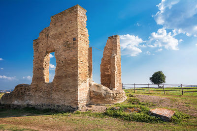 Low angle view of old ruin building against sky