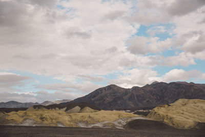 Scenic view of death valley against cloudy sky