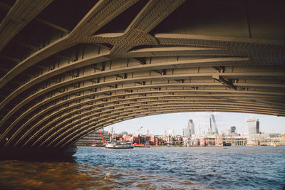 20 fenchurch london and 122 leadenhall street seen through arch bridge