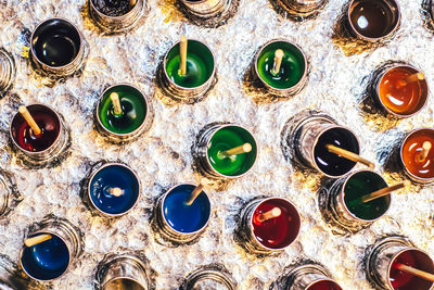 High angle view of multi colored glass on table