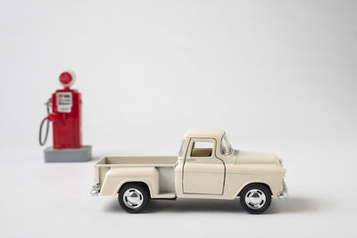 Toy car against white background