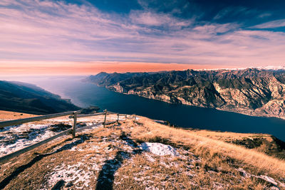 Scenic view of snowcapped mountains against sky during sunset