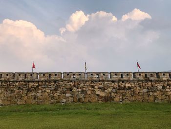 Built structure on wall against sky