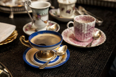 High angle view of coffee cups on table