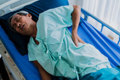 Senior patient on bed at hospital