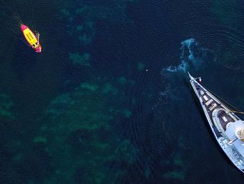 High angle view of boat sailing in sea against sky