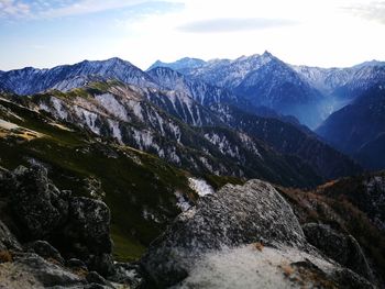 Scenic view of mountains against sky during winter