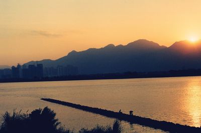 Scenic view of lake during sunset