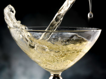 Close-up of beer glass against white background