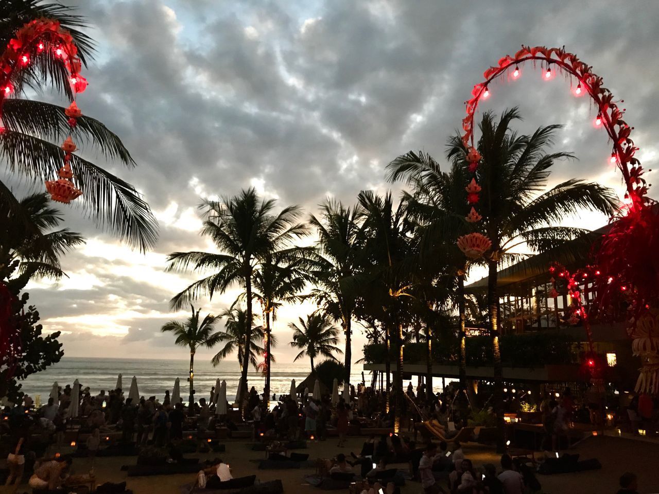 SILHOUETTE PALM TREES AGAINST SKY IN CITY