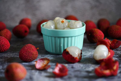 Close-up of fruits in container on table