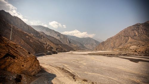 Scenic view of landscape and mountains against sky