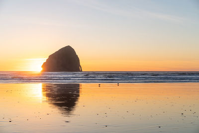 Scenic view of sea against sky during sunset