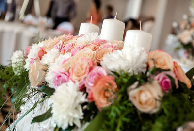 Flowers and candles on table during wedding