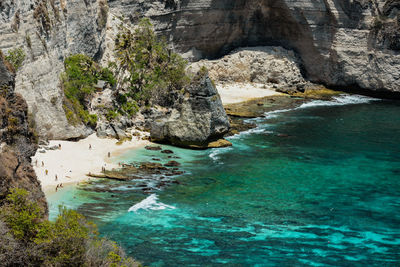 Scenic view of rocky beach against sky