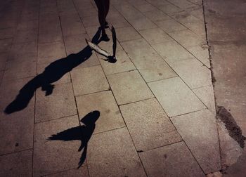 Low section of man walking on footpath