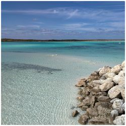 Scenic view of sea against blue sky