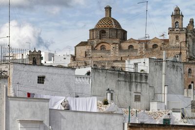 Cathedral and old buildings against sky